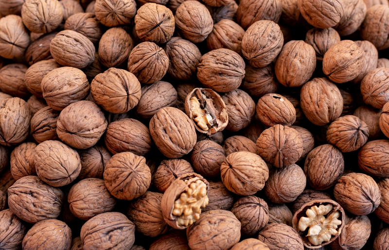 Pile of walnuts with shell